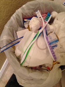 Toothbrushes in the trash. Try not to judge me by the Red Vine box and the gummy bear bag in there as well. 